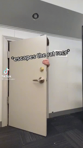 A Person Peeking Out From Behind A Door That Says " Escapes The Rat Race " On It GIF