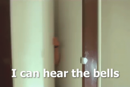 A Person Peeking Out From Behind A Door With The Words I Can Hear The Bells Below Them GIF