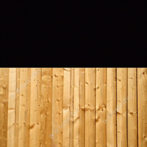 A Person Peeking Over A Wooden Fence With A Black Background In The Background GIF