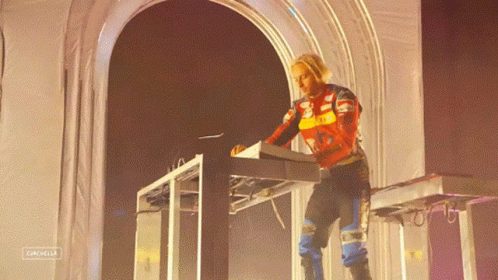 A Person Playing A Keyboard With The Word Catchella On The Bottom Right GIF
