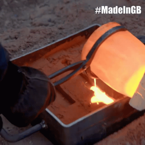A Person Pouring Molten Metal Into A Metal Container With The Hashtag #Madelngb On The Bottom GIF