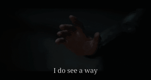 A Person Reaching Out In The Dark With The Words I Do See A Way GIF