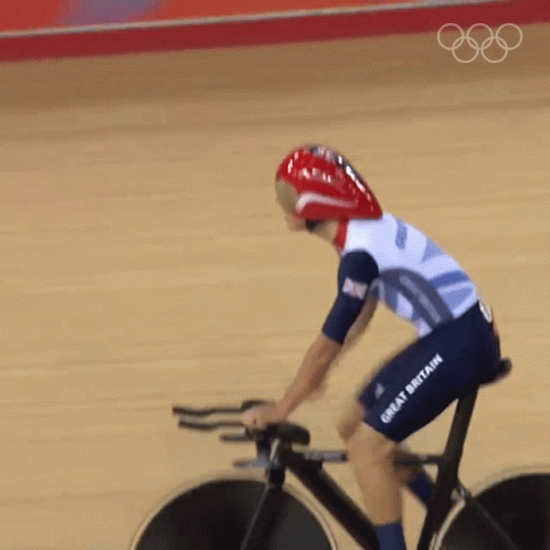 A Person Riding A Bike That Says Great Britain On The Shorts GIF