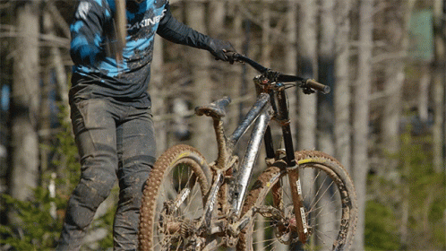 A Person Riding A Bike With A Shirt That Says Dakine GIF