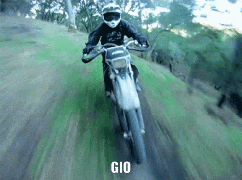 A Person Riding A Dirt Bike With The Word Gio On The Bottom Right GIF