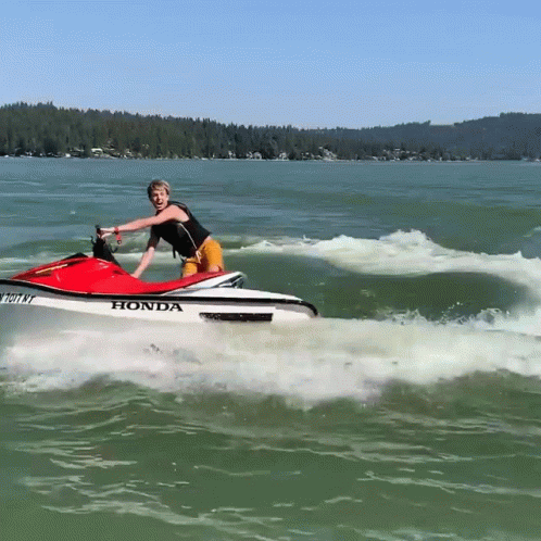 A Person Riding A Honda Jet Ski In The Water GIF