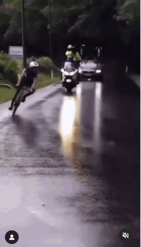 Person Riding Motorcycle On Wet Road GIF