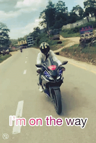 A Person Riding A Motorcycle With The Words I 'M On The Way GIF