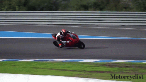 A Person Riding A Red Motorcycle On A Track With The Words Motorcyclist Below Them GIF