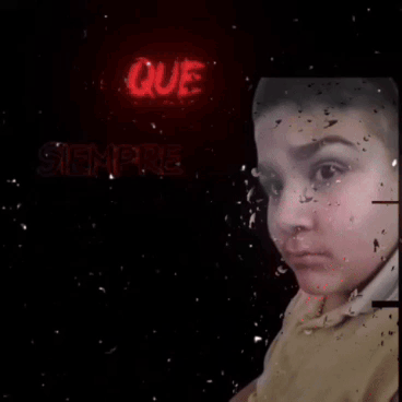 A Person 'S Face Is Visible In Front Of A Neon Sign That Says Nanda Audio . GIF