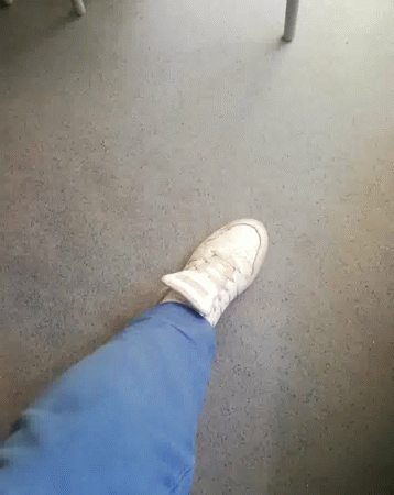A Person 'S Foot Is Shown With A Pair Of White Shoes On GIF