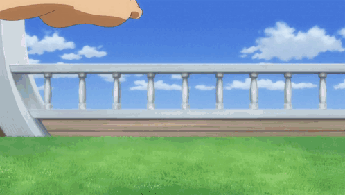 a person 's foot with a bracelet on it is walking on the grass