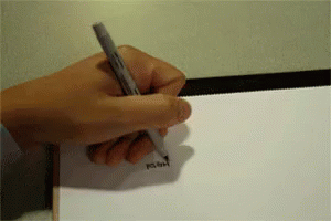A Person 'S Hand Is Holding A Pen Over A Piece Of Paper GIF