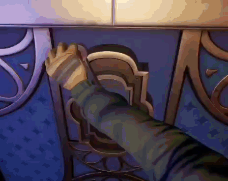 A Person 'S Hand Is Reaching Out To Open A Door In A Video Game . GIF