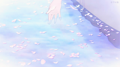 A Person 'S Hand Is Reaching Out To Touch A Stream Of Water GIF