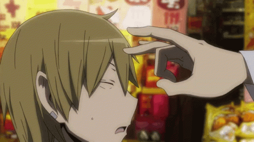 A Person 'S Hand Is Touching Another Person 'S Forehead In Front Of A Sign That Says Mcdonalds GIF