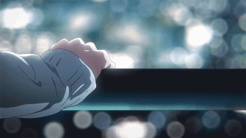 A Person 'S Hand Rests On A Railing In Front Of A Window GIF