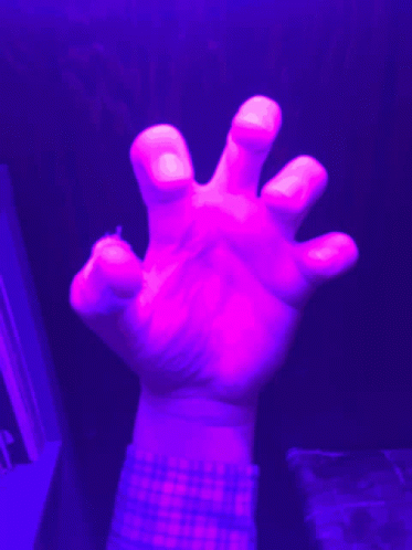 A Person 'S Hand With A Plaid Shirt On Is Reaching Out GIF