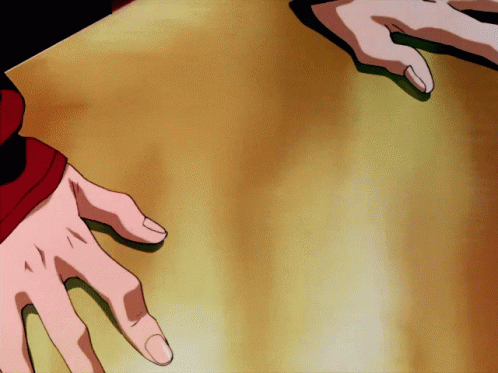 A Person 'S Hands Are Reaching Out Towards Each Other GIF