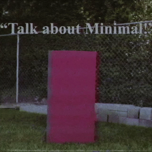 A Person 'S Legs Are Sticking Out Of A Pink Box With The Words " Talk About Minimal " Above Them GIF