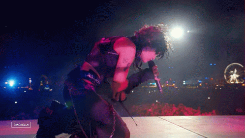 A Person Singing Into A Microphone With The Word Cancella On The Bottom GIF