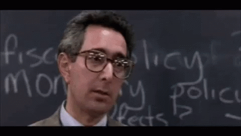 A Person Sitting In A Classroom With The Word Bueller Written On The Screen GIF