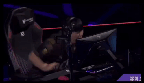 A Person Sitting In Front Of A Computer With A Shirt That Says ' Gen ' On It GIF