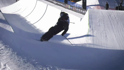 A Person Skiing Down A Snowy Slope With The Number 3 On The Back Of Their Jacket GIF