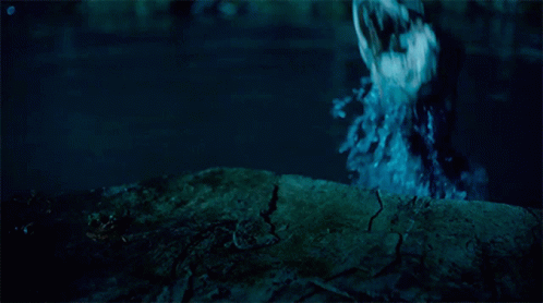 A Person Standing In A Body Of Water With A Blue Background GIF