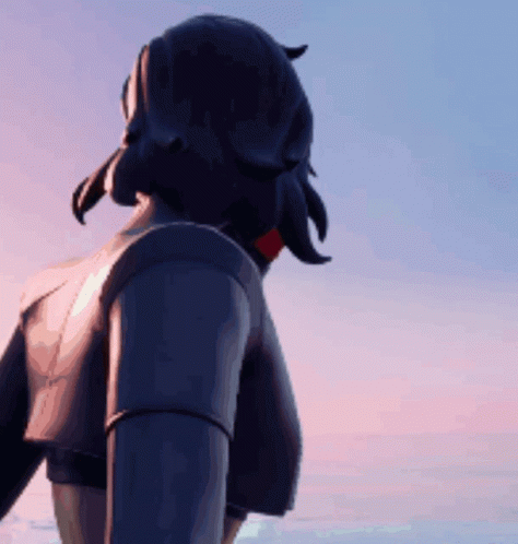 A Person Standing In Front Of A Blue Sky With A Sunset In The Background GIF