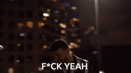 A Person Standing In Front Of A Building That Says F * Ck Yeah On It GIF