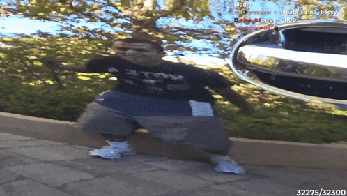 A Person Standing In Front Of A Car With The Number 32375 On The Bottom Right GIF