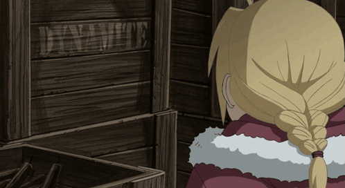 A Person Standing In Front Of A Wooden Crate That Says Dynamite GIF