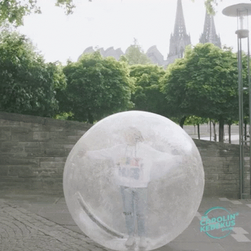 A Person Standing Inside Of A Clear Bubble That Says Carolin Kedkus Show GIF