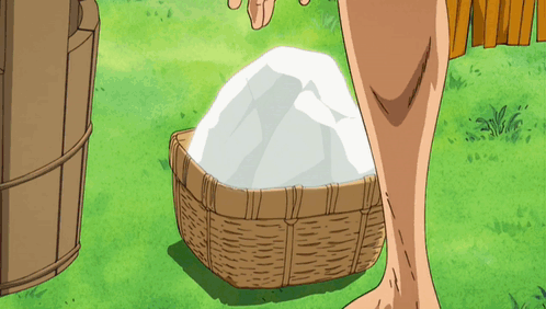 A Person Standing Next To A Basket Filled With Ice GIF