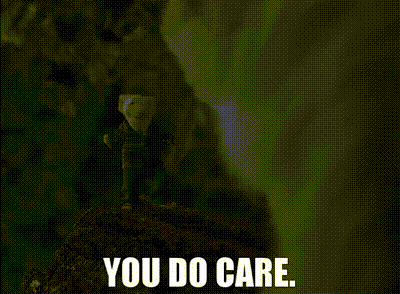 A Person Standing On Top Of A Rock With The Words You Do Care Below Them . GIF