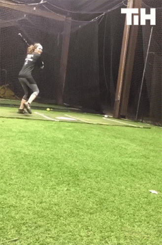 A Person Swinging A Bat With The Letters Th Above GIF