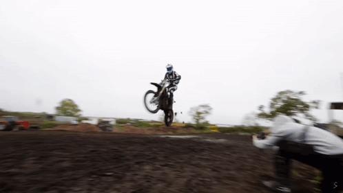 A Person Taking A Picture Of A Person On A Motorcycle GIF