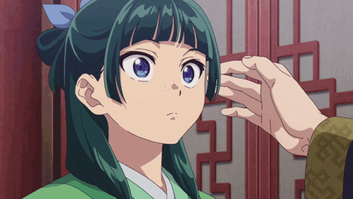A Person Touches A Girl 'S Face With Their Hand GIF