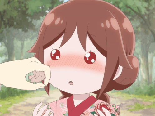 A Person Touching A Girl 'S Face With A Pink Kimono On GIF