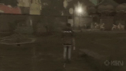 A Person Walking In A Dark Room With Ign On The Bottom GIF