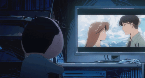 A Person Watching A Cartoon On A Computer Monitor GIF