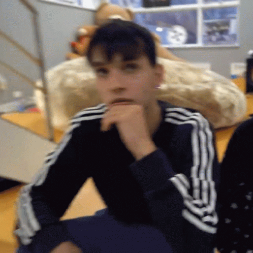A Person Wearing A Black And White Adidas Sweatshirt GIF