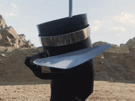 A Person Wearing A Black Hat With A Silver Band Around The Brim GIF