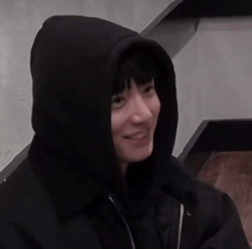 A Person Wearing A Black Hoodie With A Hood On Their Head GIF