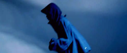 A Person Wearing A Blue Jacket With A Hood On GIF