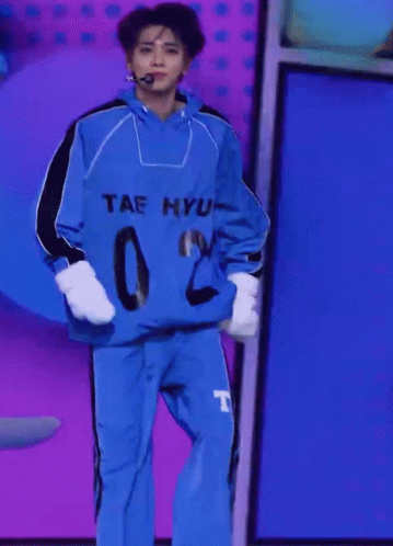 A Person Wearing A Blue Shirt That Says Tae Hyun GIF