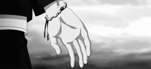 A Person Wearing A Bracelet On Their Wrist Is Holding Another Person 'S Hand In A Black And White Photo . GIF