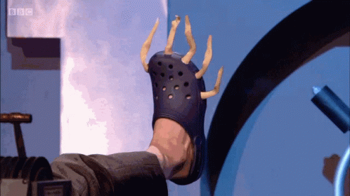 A Person Wearing A Croc With A Bbc Logo On The Bottom Right GIF