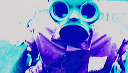A Person Wearing A Gas Mask And Goggles With A Purple Background GIF